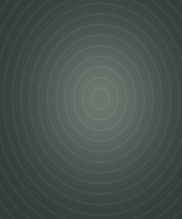 Faint concentric rings on dark teal, evoking a deep, steady hum